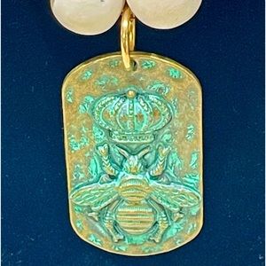 Gorgeous,beige and gold and patina bead with a patina bumblebee pendant